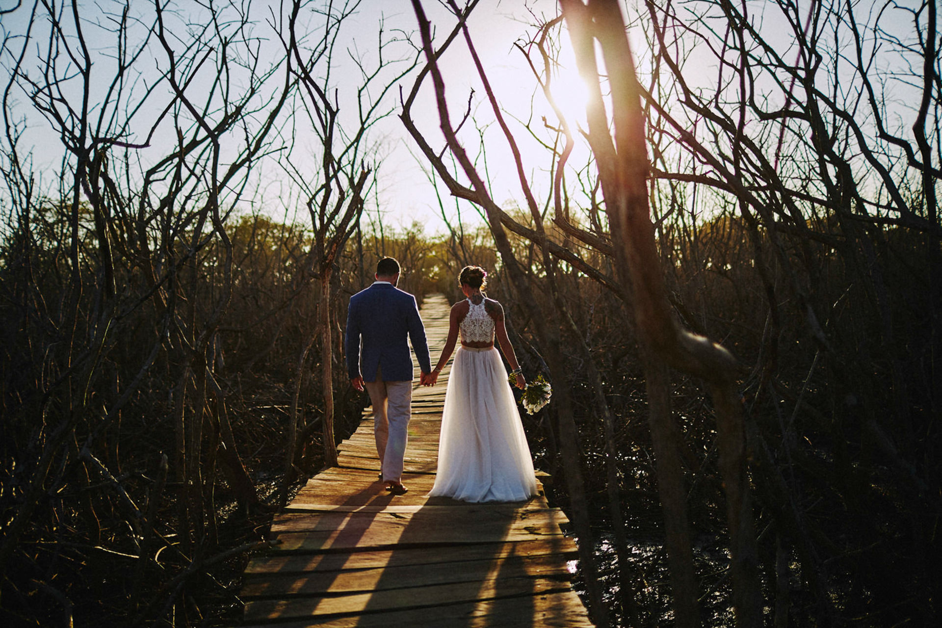 couple eloping in costa rica with beach mangroove landscape